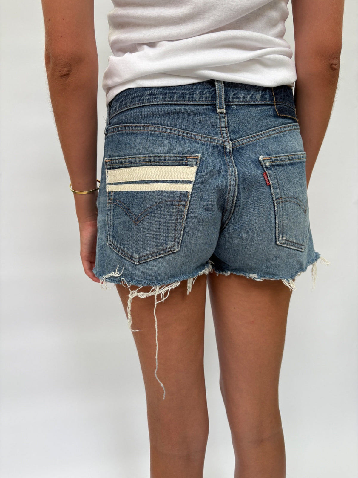 047. Levi's Cut Offs White Tape