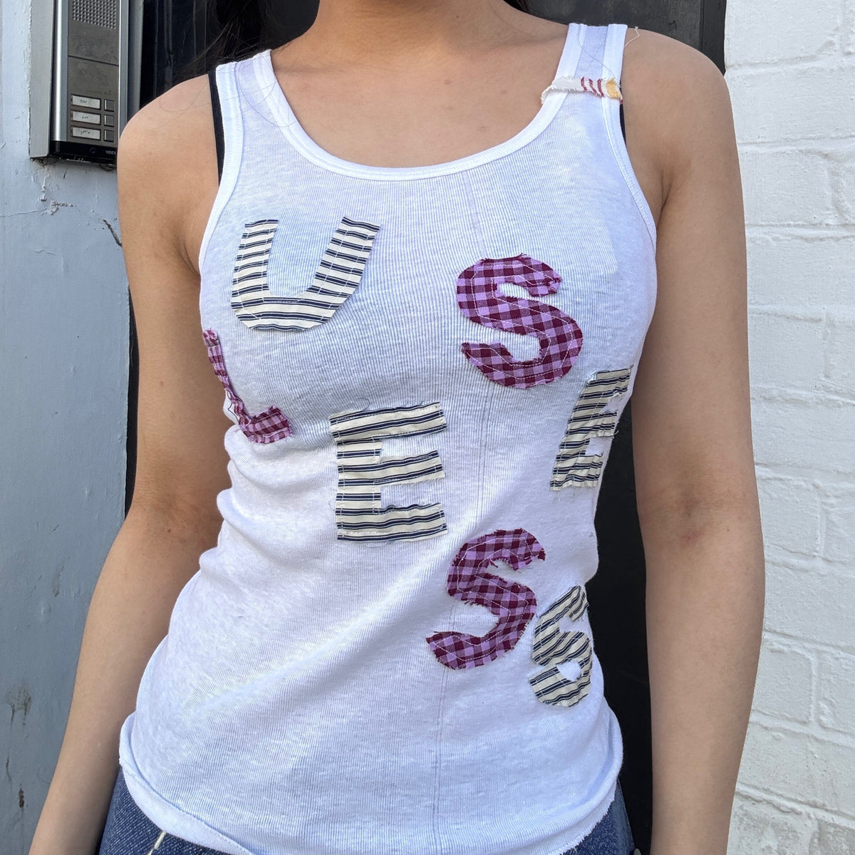 Useless Upcycled White Tank with ‘Useless’ appliqué